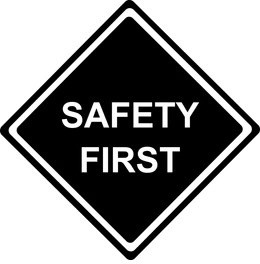 a black and white sign reading safety first